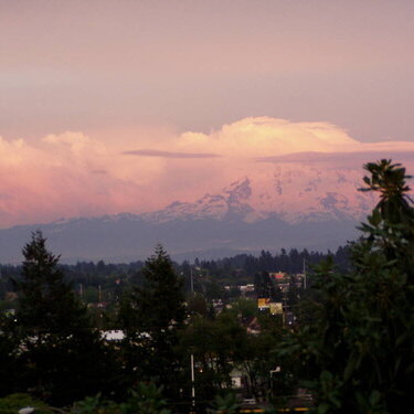 Strawberry shortcake sunset reflecting on the clouds over Mt. Rainier