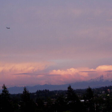 Strawberry shortcake sunset reflecting on the clouds over Mnt. Rainier