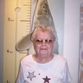 Grandma Sees how she measures up to a sturgeon
