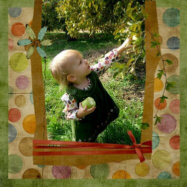 Cora picking apples