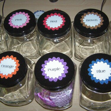 Altered candy Jar lids (Flower storage)