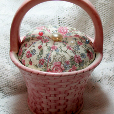 Pincushion in a ceramic basket