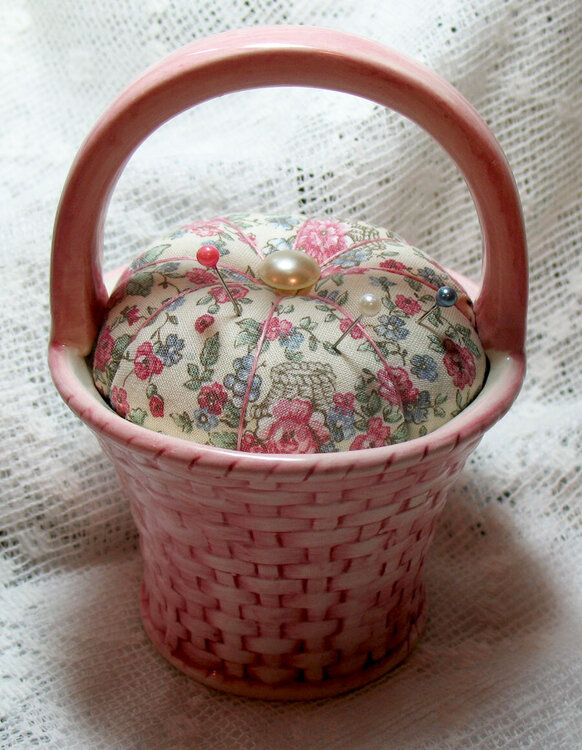 Pincushion in a ceramic basket