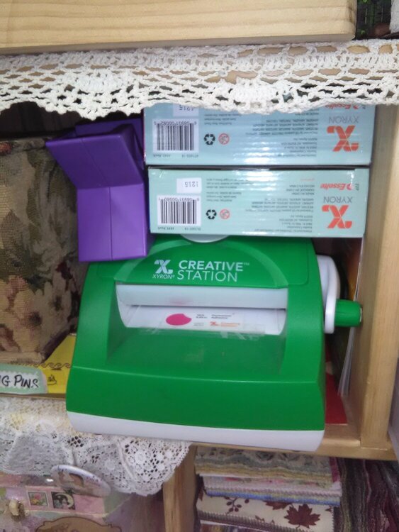 Storage for my 2 Zyron sticker makers plus green one also laminates.