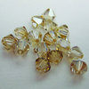 EK Success - Jolee's Jewels - Crystallized Swarovski Elements Collection - Jewelry Beads - Bicone - 6 mm - Golden Shadow